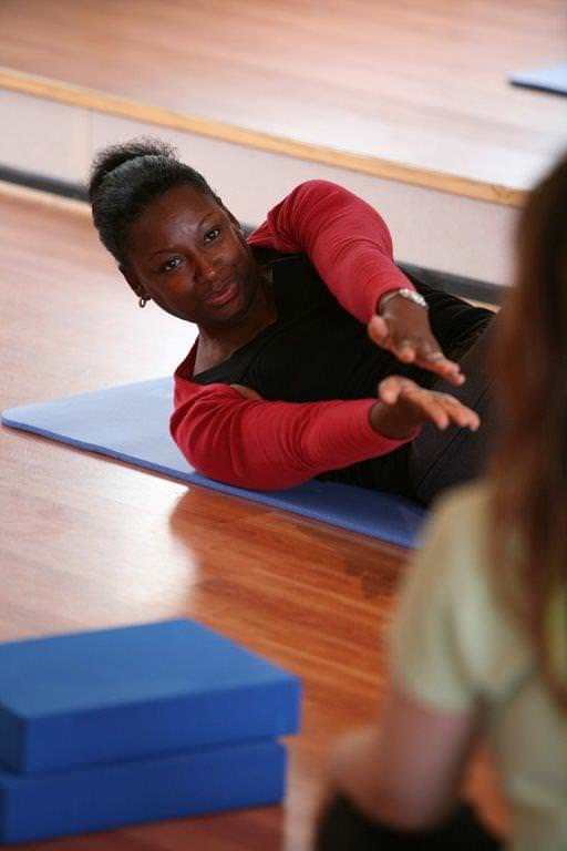 Ethelinda Lashley giving instruction on a one to one basis, during a pliates class in Edinburgh
